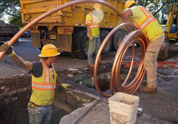 Workmen in Newark prepare to replace older water pipes with copper ones in October 2021. (Seth Wenig/AP)
